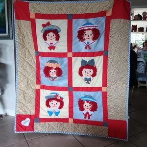 vintage Raggedy Ann and Andy quilt features plush 3D applique faces